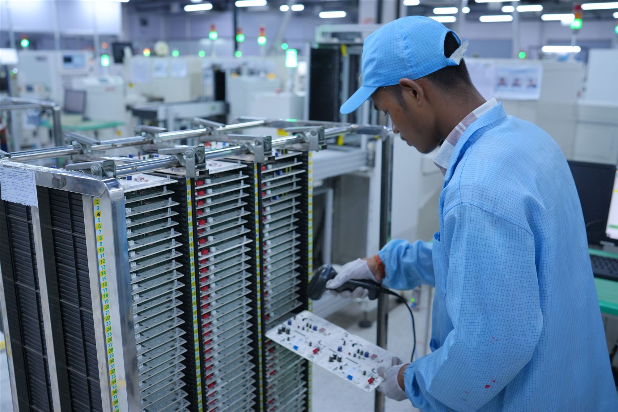 PCT technician controlling circuit boards for production